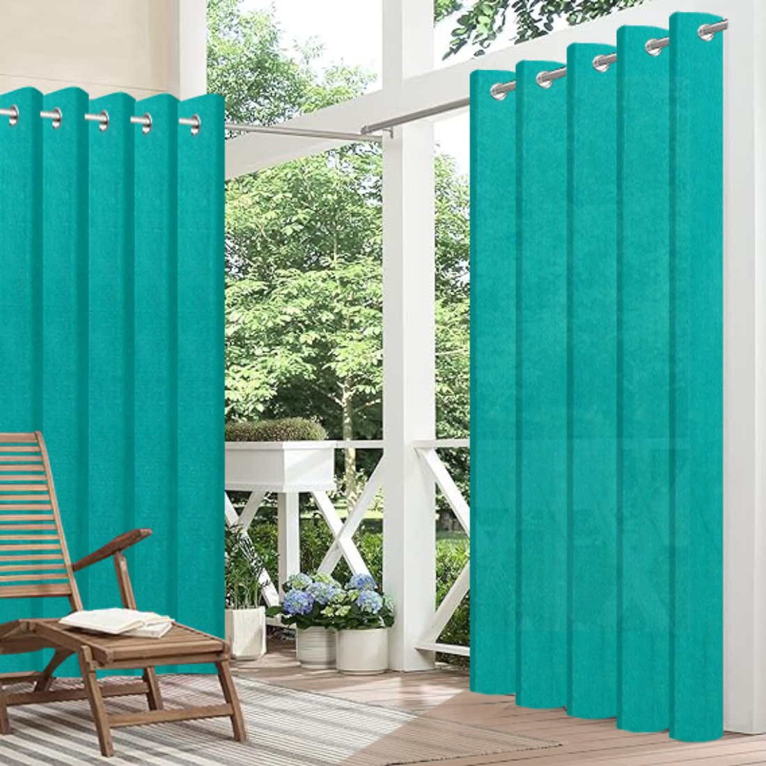 Teal outdoor curtains on a patio with a chair and plants.