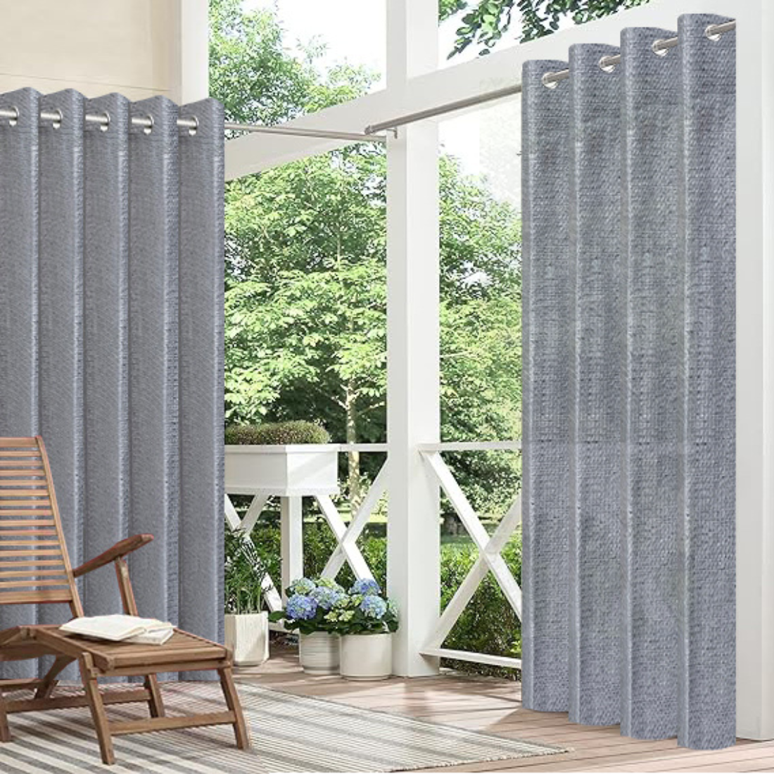 Outdoor patio with gray curtains, wooden chair, and potted plants.