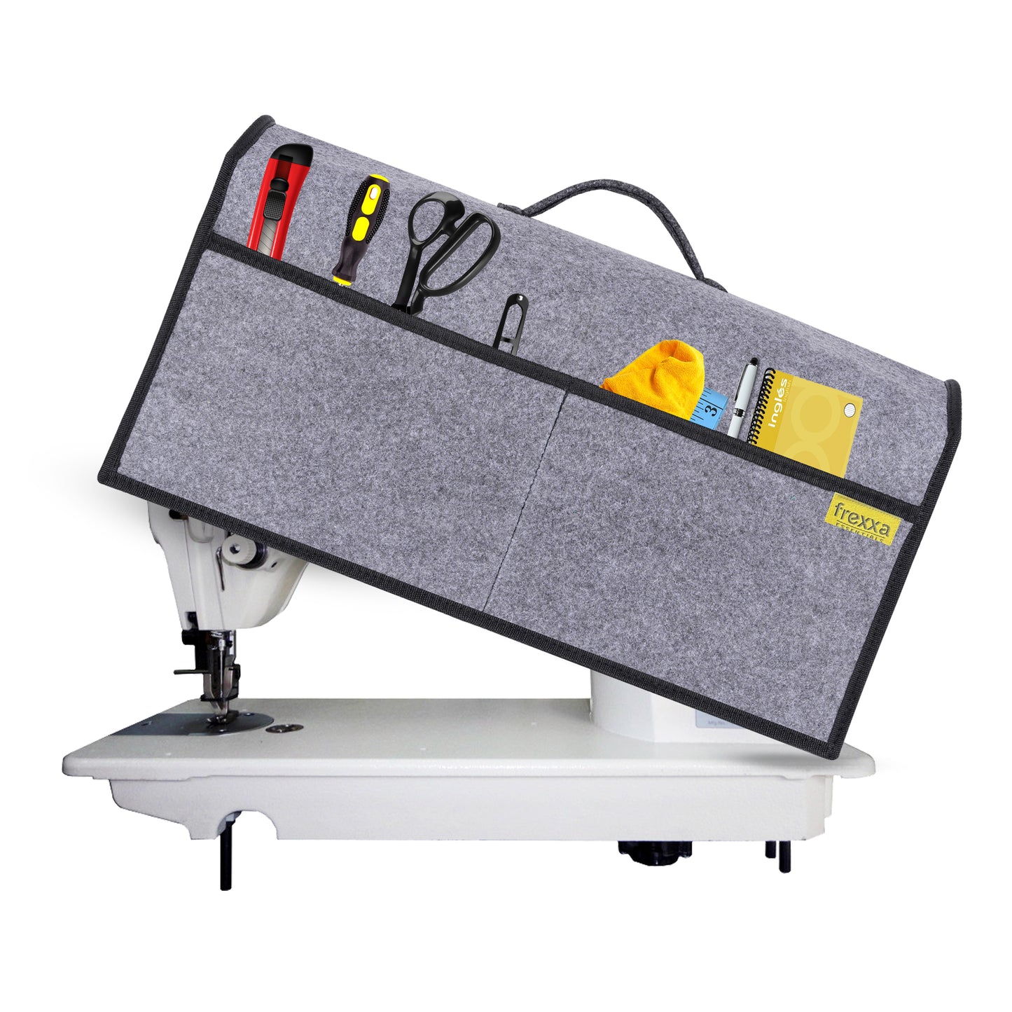 Sewing machine with a gray extension table and various tools on a white background