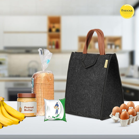 Black lunch bag with bread, peanut butter, bananas, and eggs on a kitchen counter with 'frexxa' branding.