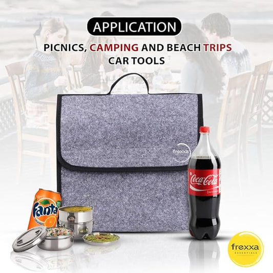 Gray cooler bag with Frexxa branding, surrounded by picnic items like Fanta, Coca-Cola, and metal containers on a white background.
