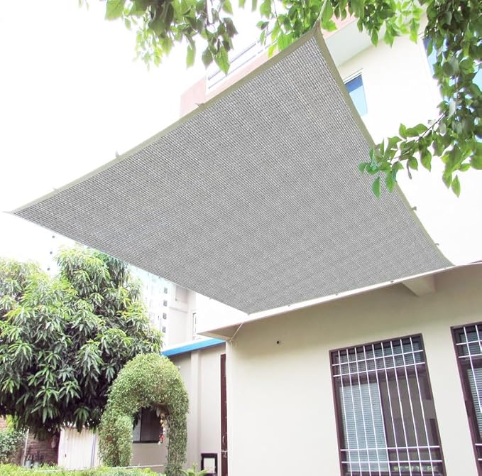 Gray awning on a building with trees in the background