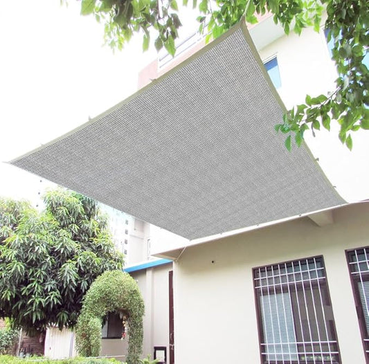 Gray awning on a building with trees in the background