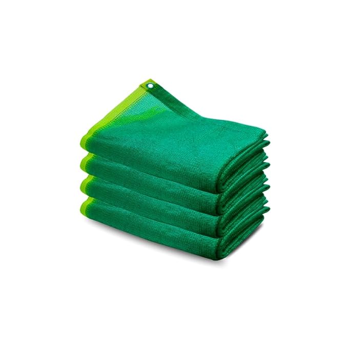 Stack of green folded cloths on a white background
