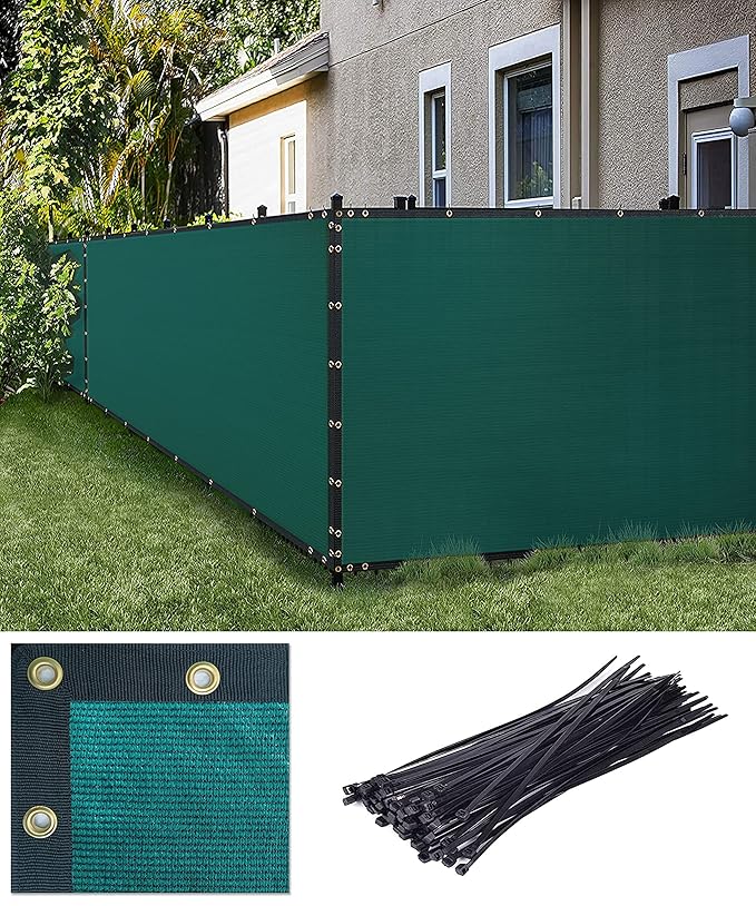 Green privacy screen with grommets and ties in front of a house