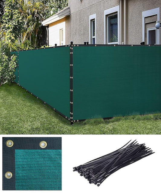 Green privacy screen with grommets and ties in front of a house