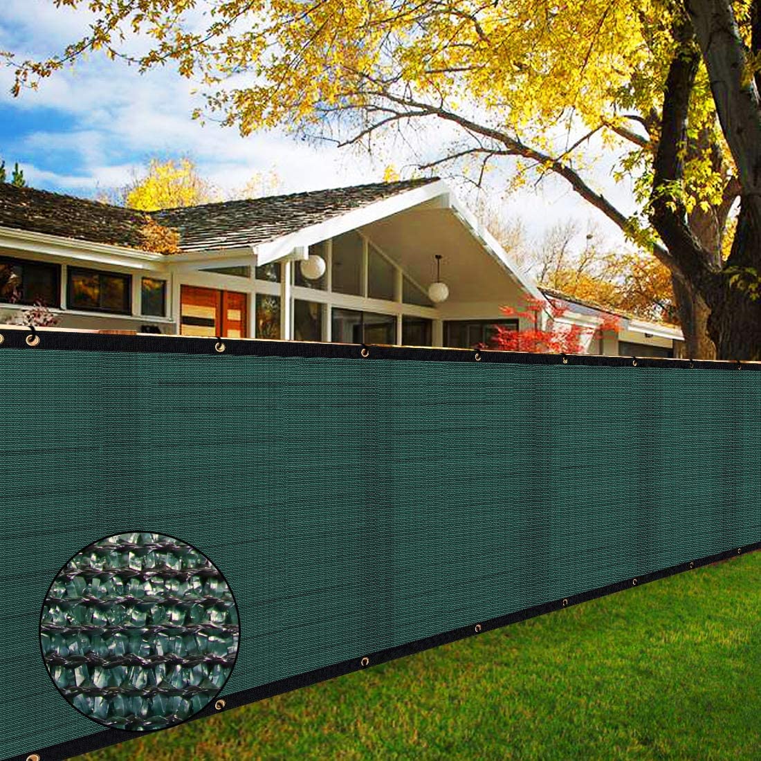 Green privacy screen with detailed texture overlay in front of a house with a tree in the background.