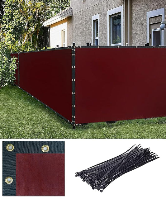 Red privacy screen with black ties in front of a house