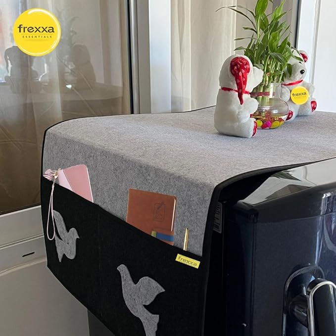 Gray tablecloth with frexxa logo on a table with decorative items.