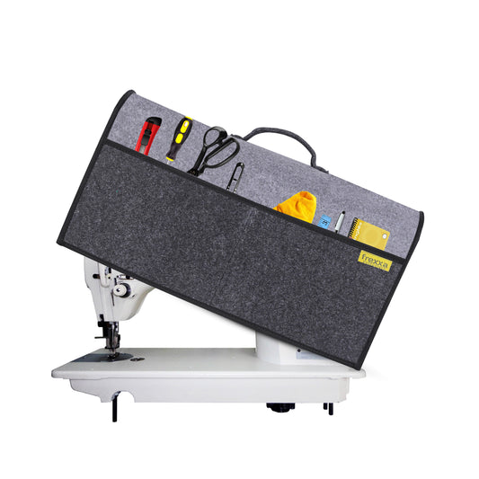 Sewing machine with a gray storage bag on a white background
