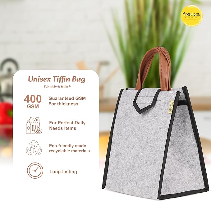 Unisex tiffin bag with handle, featuring frexxa branding, on a blurred background.