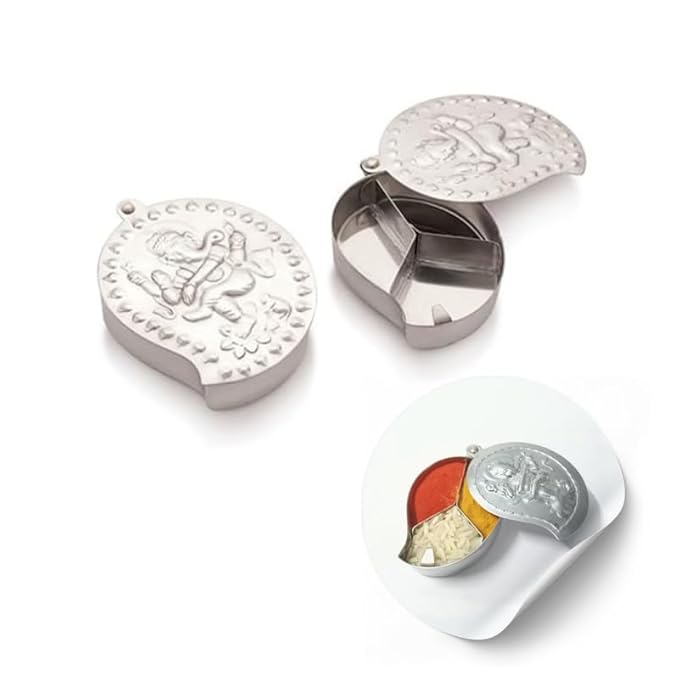 Metallic jewelry display case with engraved designs on a white background