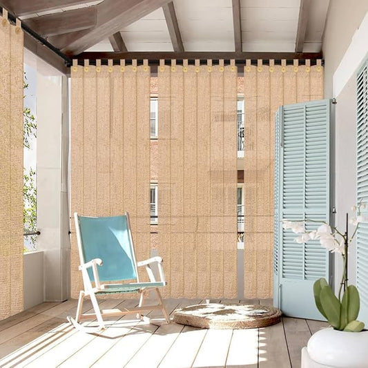 Beige outdoor curtain with a chair and plant in a sunroom setting