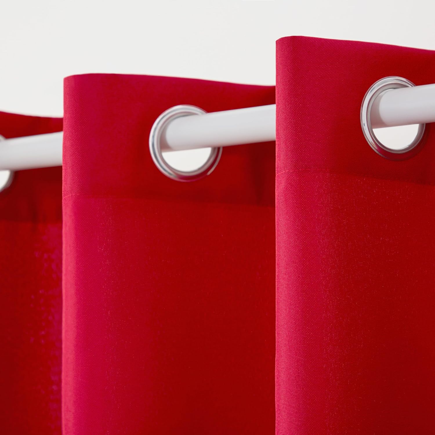 Red curtains with white rings on a white background