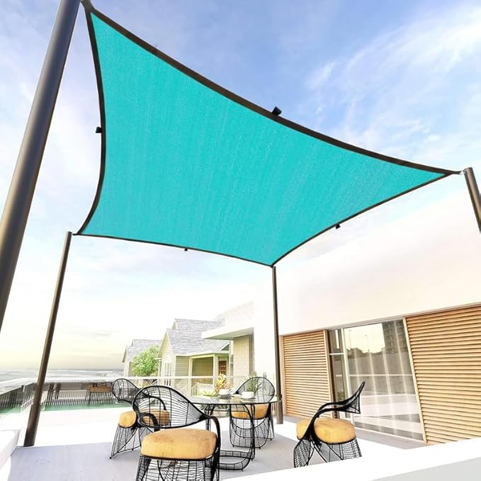 Turquoise shade sail over outdoor furniture on a patio