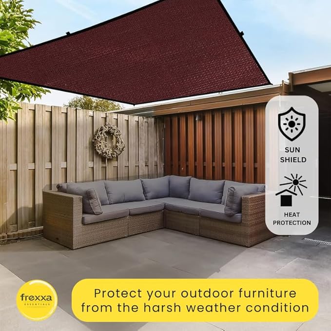 Outdoor patio with gray sectional sofa under a sun shield, featuring Frexxa brand.