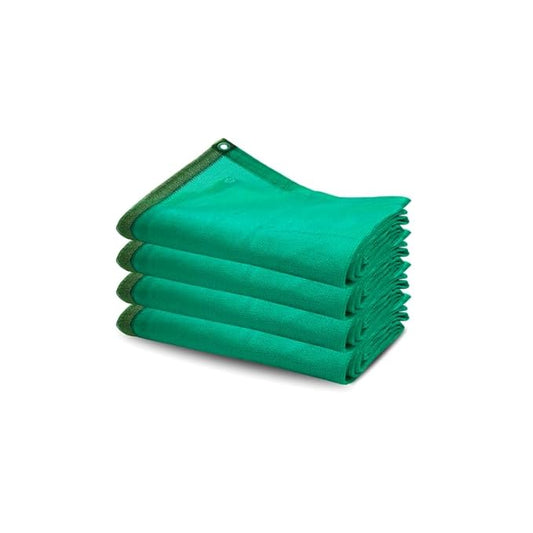 Stack of green towels on a white background
